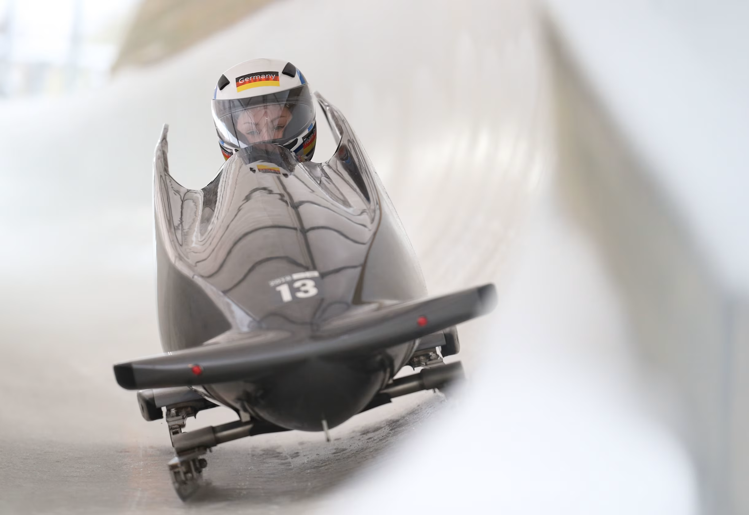 person sledding downhill