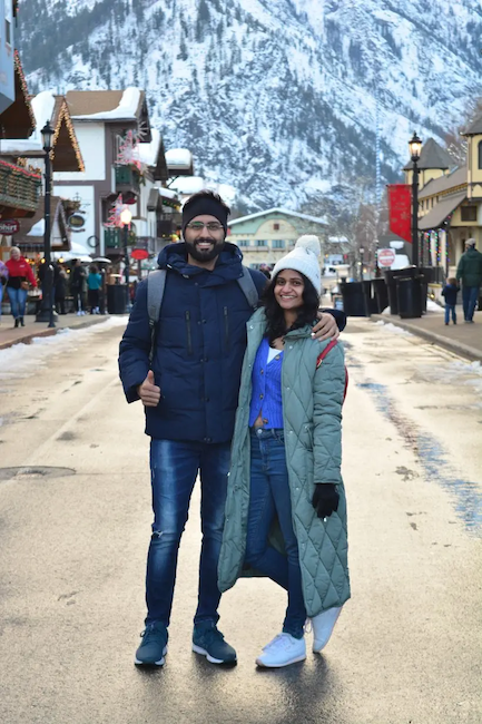 Athira and her husband at a ski resort in Europe.