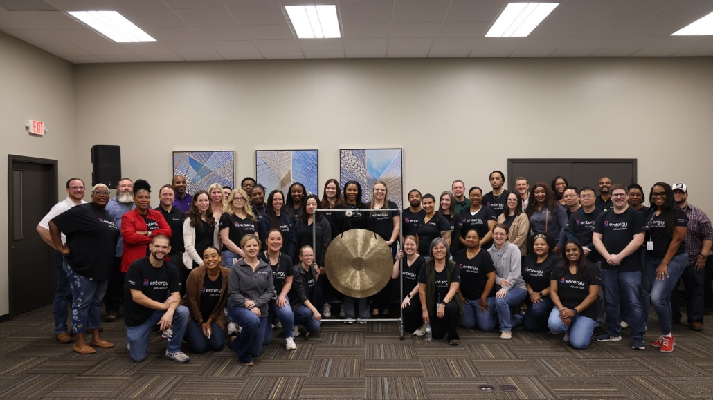 Volunteers posing by a gong