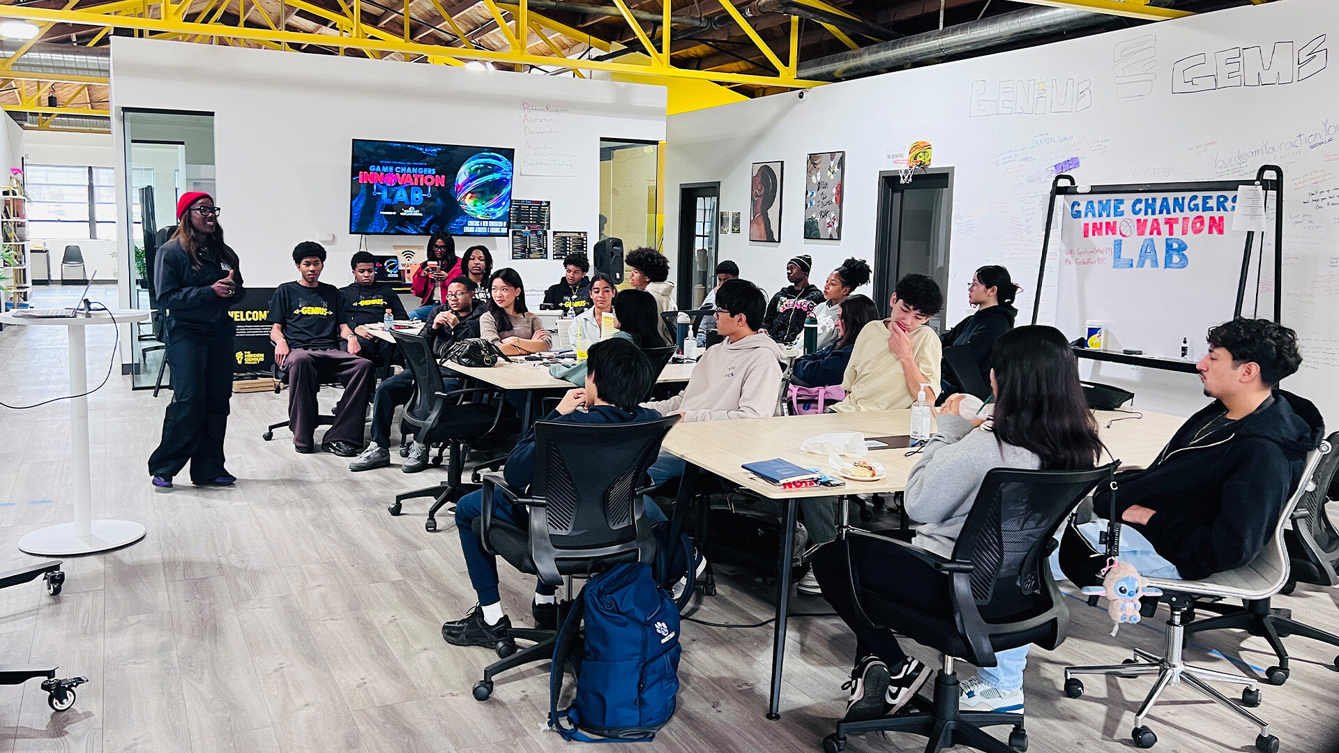 Coach provides instruction to help students concept their sports innovation project