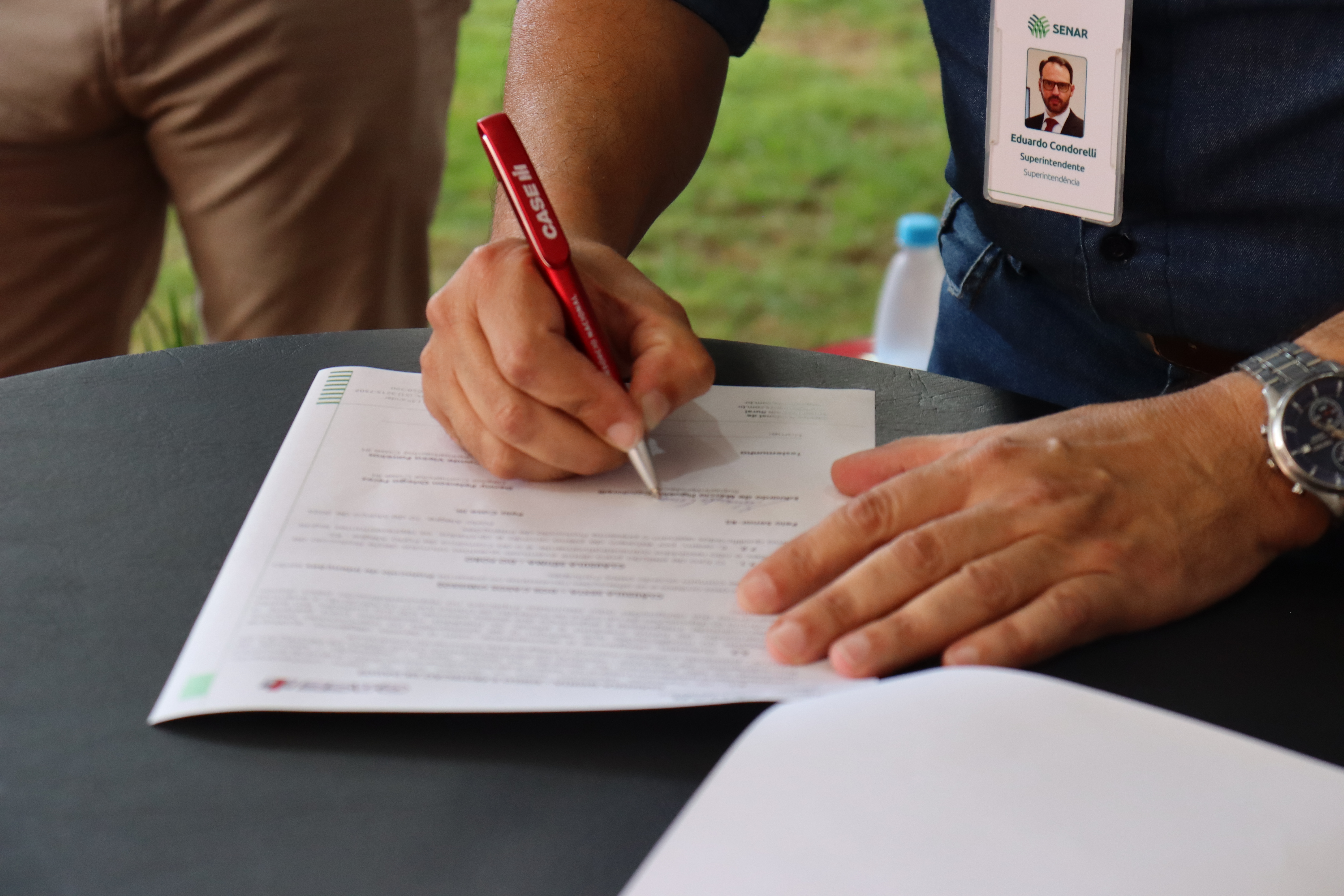 person writing on some paper