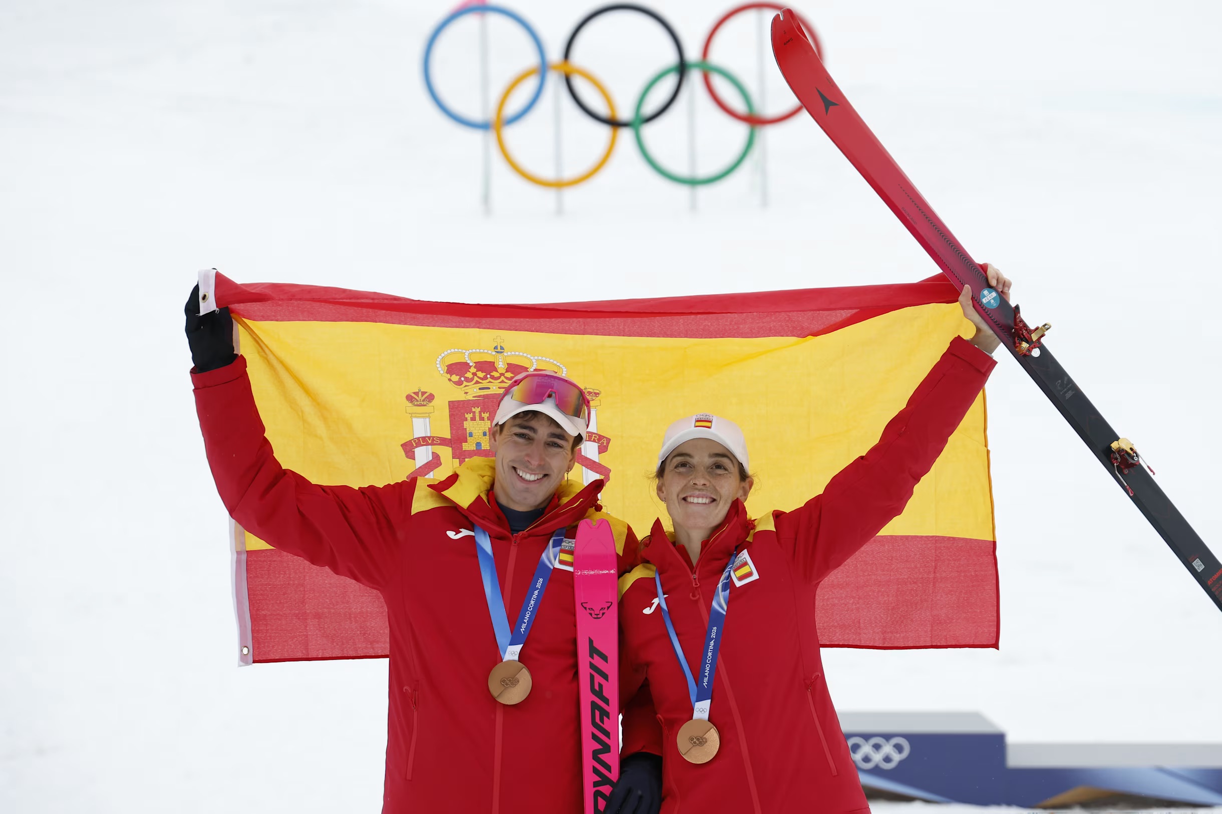 two medal winners smiling