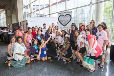 Mary Kay independent sales force members attending Seminar made time to help build 2,000 Mary Kay care kits to be donated to domestic violence shelters across the U.S.