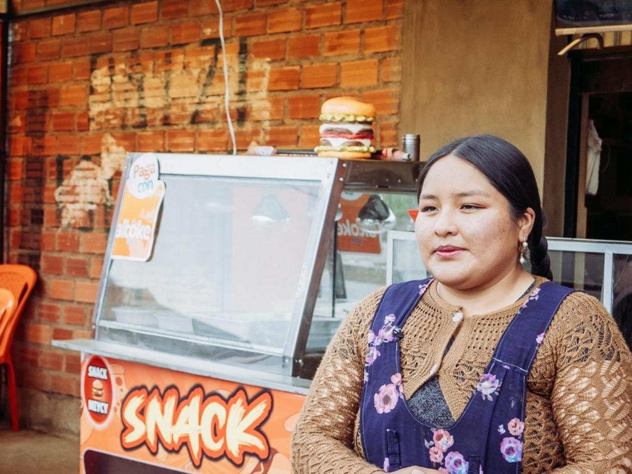 person standing in front of a snack store
