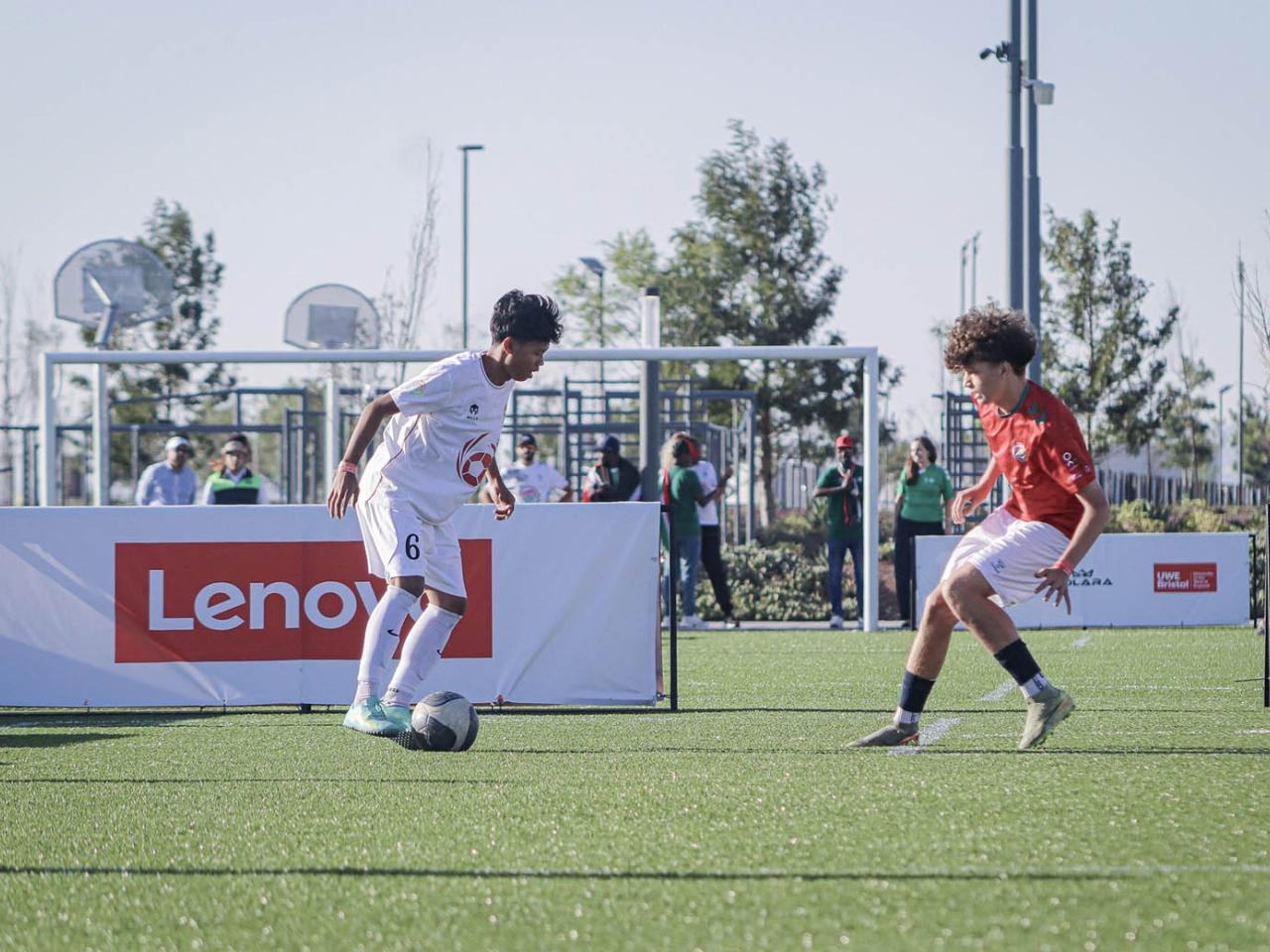 2 young people playing soccer