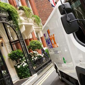 FedEx truck in front of an apartment building