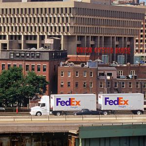 FedEx truck on a city highway