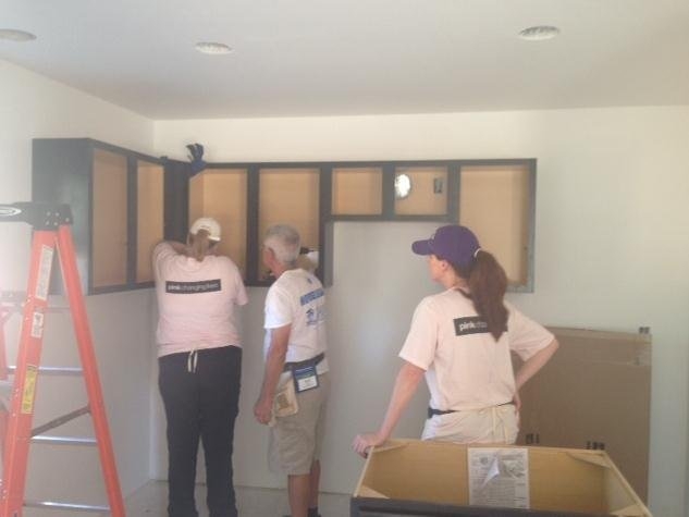 It is an incredible experience to see what one 8 hour day can accomplish with a crew of enthusiastic volunteers. This year we worked on the interior of the house installing base boards, doors, and kitchen cabinets. The kitchen group consisted of Shannon Summers, Allyson Sellers, myself, and our very patient teacher Bob installing cabinets. We took an empty space and created a kitchen that our homeowner would love for many years to come.