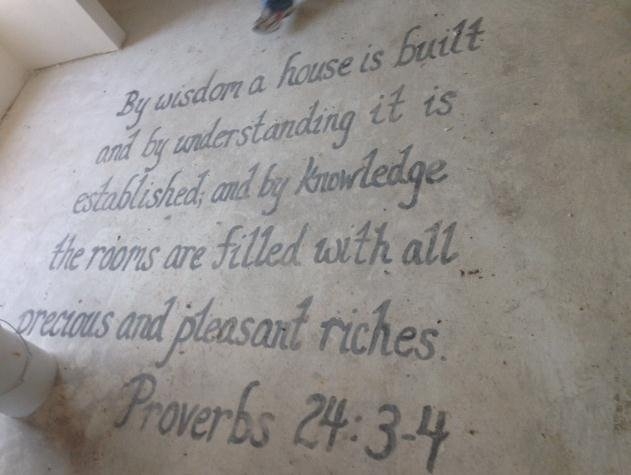 One of the most touching moments during our work day was the discovery of an inscription on the concrete as we walked into the home for the first time. Each house has an Angel of Love that inscribes a scripture on the cement slab before building day. No one could say for certain whom this Angel is, only that she blesses each house with love.